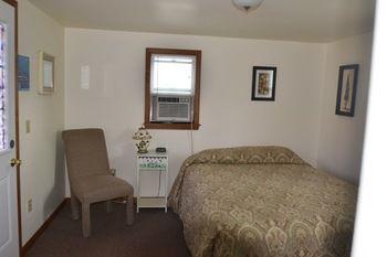 Отель Lucky Horseshoe Cabins Au Sable Экстерьер фото